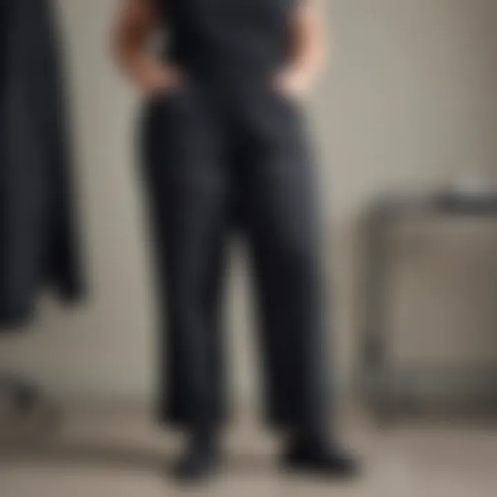 Stylish plus size black scrub pants displayed on a rack