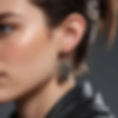 Close-up view of a model wearing a statement punk earring at a fashion event