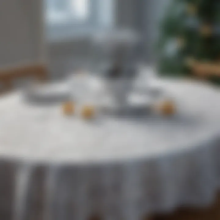 Table setting featuring a snowflake tablecloth with seasonal decor