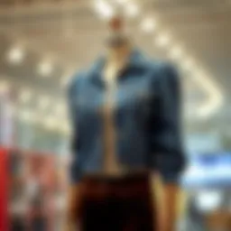 Stylish cropped denim jacket with puff shoulders on a mannequin