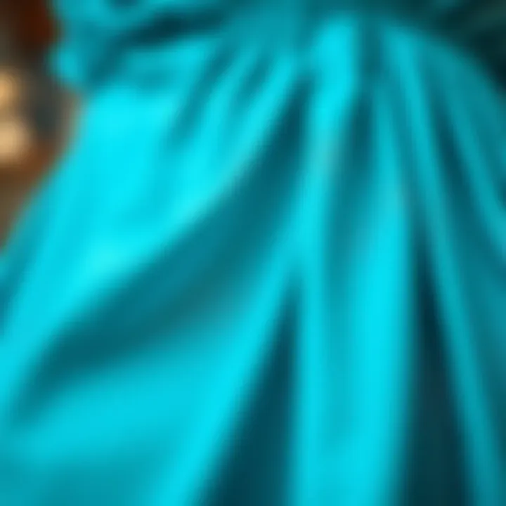 Close-up of fabric texture in aqua blue dress