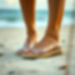 Elegant clear espadrille sandals on a sandy beach