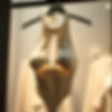 Elegant display of a white halterneck bodysuit on a hanger