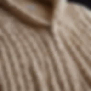 Close-up of the intricate cable knit patterns showcasing the craftsmanship of the cardigan.